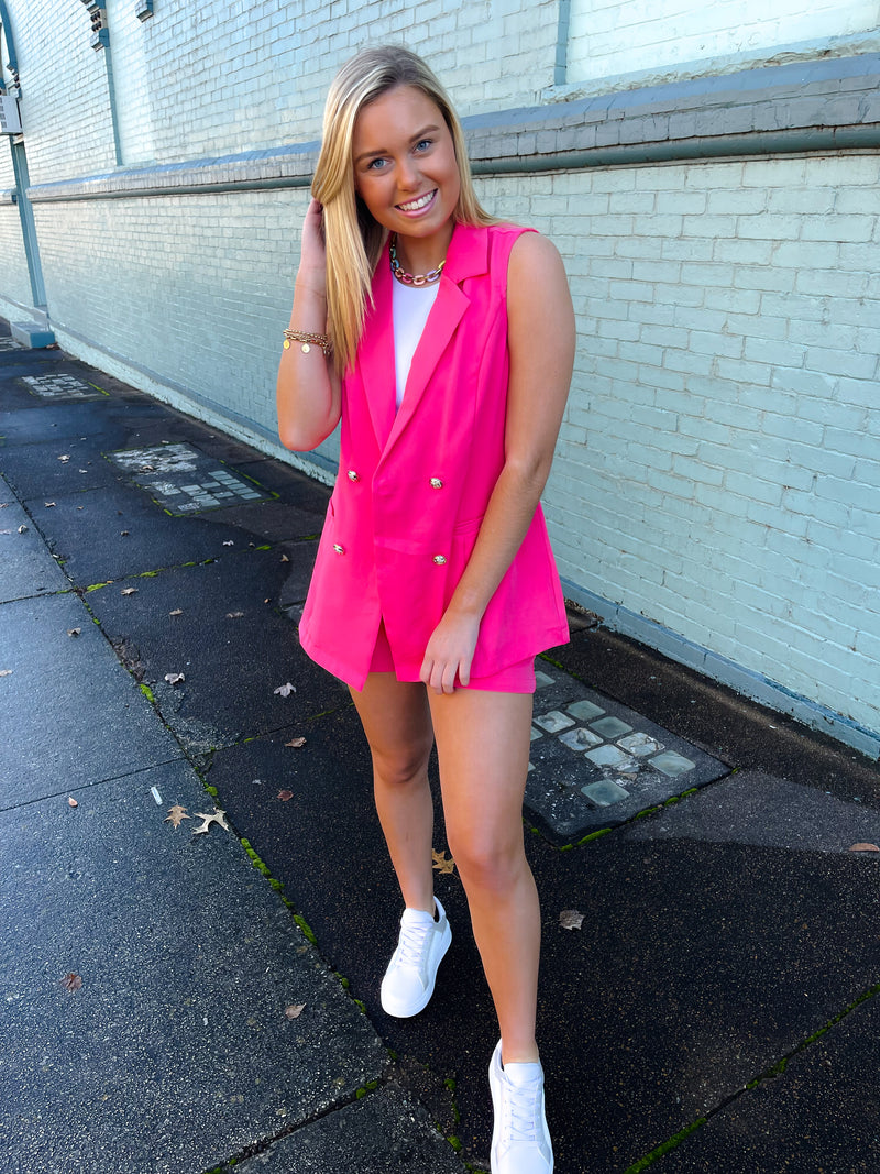 Blazer features a jaw dropping hot pink color, sleeveless detail, open front detail, front pockets, functional buttons and runs true to size!   Matching shorts feature a zip up closure, upper thigh length, belt detail, functional pockets and runs true to size! 