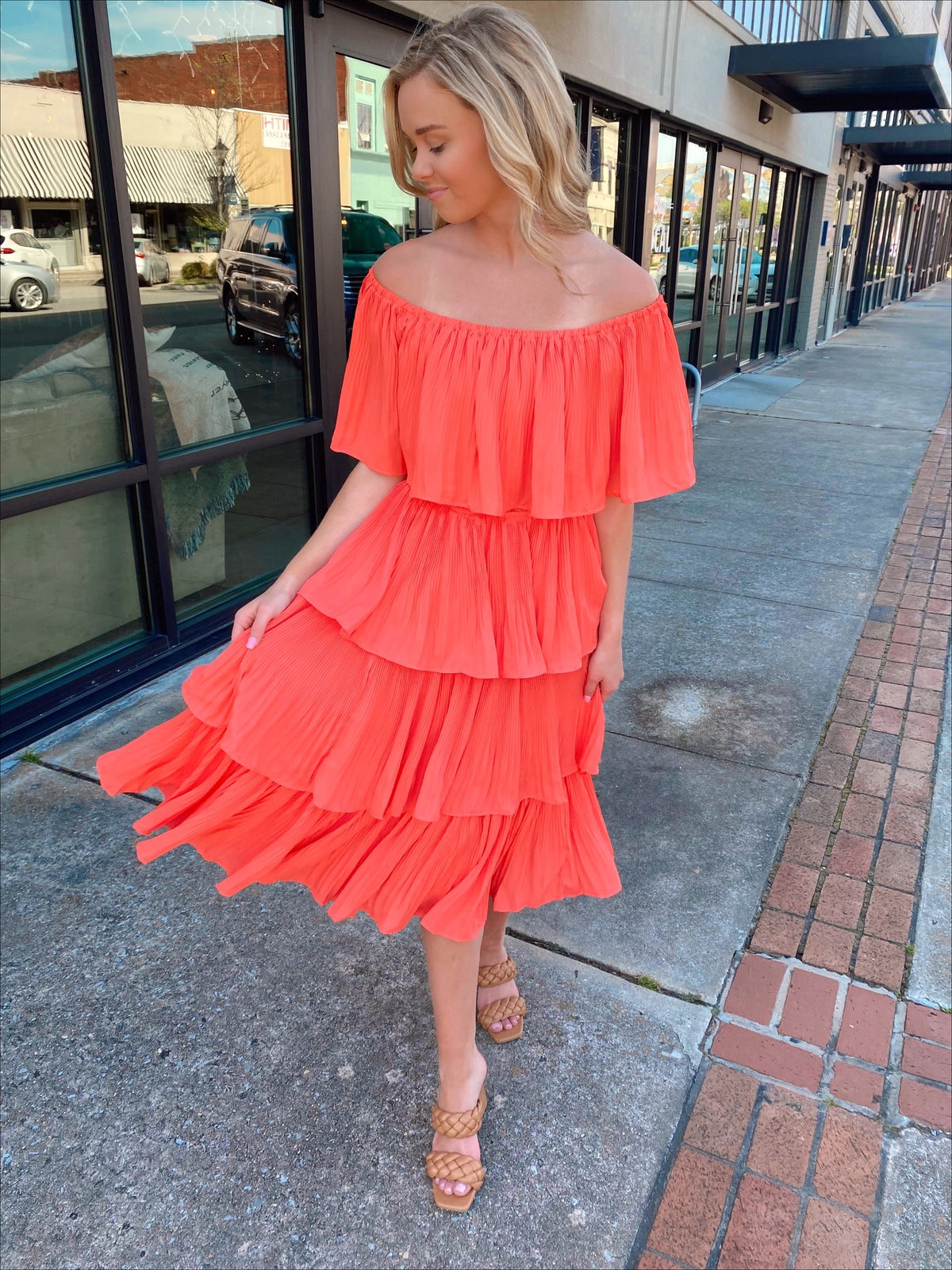 Dress features a coral color, layered detailing, off/on shoulder detail, underlining, midi length and runs true to size! 