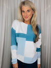 Top features a color block detail, long sleeves, soft material, round neck line, comfortable fit and runs true to size-blue