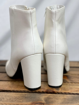 These booties feature a white color, square toe, 3-inch heel, zipper closure and run true to size! 