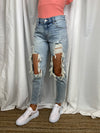 Jeans feature a medium denim wash, front distressing, functional pockets, boyfriend fit and runs true to size! 