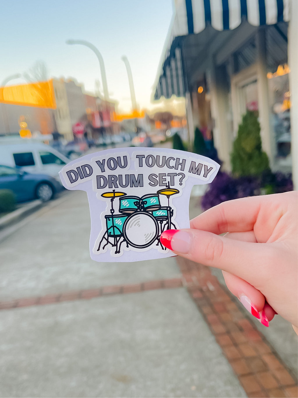 Did you touch my drum set?  Design approx. 3.5"-L x 2.5"-W  Durable Laminate Vinyl  Laminate vinyl is weatherproof and protects from rain and sunlight, as well as scratching  Put these vinyl stickers on drinkware, laptops, notebooks, etc!