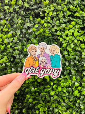 This Girl Gang-Golden Girls sticker decal is the ultimate way to show off your favorite girl gang. Crafted from durable laminate vinyl, the sticker decal can be safely stuck to any surface, from water bottles to computers. Show your Girl Gang pride today with this stylish, long-lasting sticker decal.