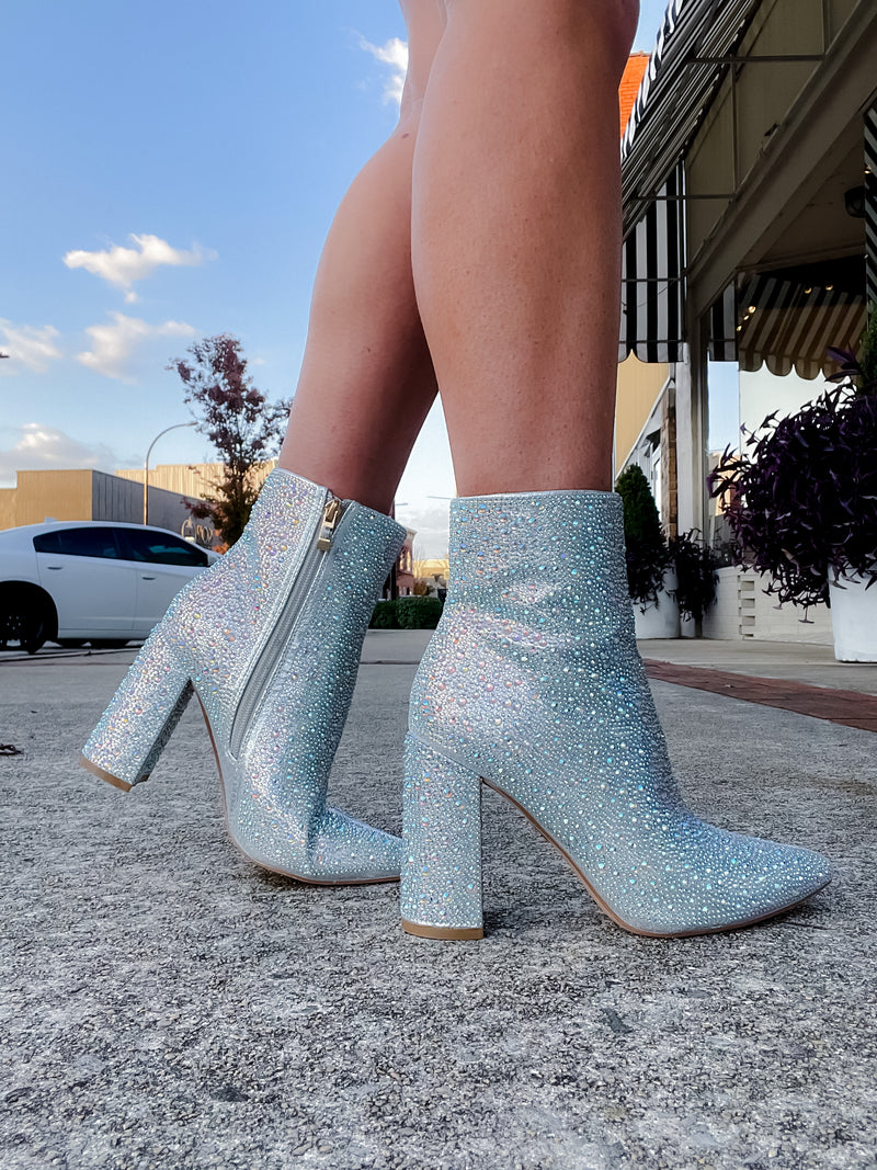 Booties feature a show stopping appearance, block heel, full sequin/rhinestone detailing, side zip-up closure and runs true to size! -silver