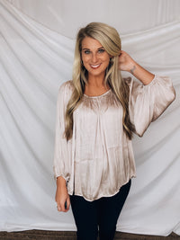 Top features a light champagne color, peasant sleeves, ruffled detail, elastic waist/ shoulder, loose fit, can be worn on or off the shoulder and runs true to size! 