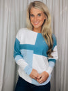 Top features a color block detail, long sleeves, soft material, round neck line, comfortable fit and runs true to size-blue