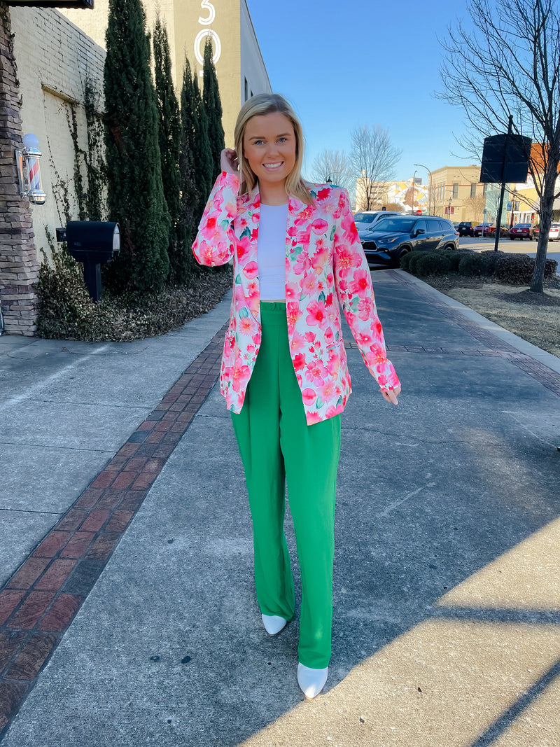 Blazer features a fun pink and white floral detail, long sleeves, collared detail, functional pockets, underlining detail, shoulder pads and runs true to size!