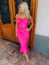 Dress features a solid base color, strapless detail, high-low hem line, front tie bow, mermaid fit and runs true to size! -hot pink