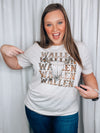 Graphic tee features a heathered neutral colored tee, short sleeves, vintage western design, unisex fit, round neck line and runs true to size! 