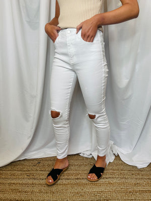 Bottoms feature a skinny leg fit, stretchy material, distressed ankle detail, high rise waist line and runs true to size! 
