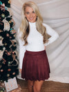 Skirt features a suede material, burgundy color, pleated detail, fitted waist, thicker material and runs true to size! 