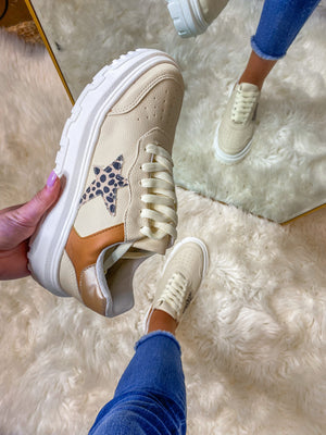 Sneakers feature a padded insole with a cheetah printed star and lace-up detail. Ladies, this is the perfect addition to your everyday look! Runs true to size. 