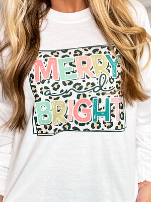 Graphic tee features a white base, long sleeves, unisex fit, round neck line, leopard box and neon and pastel colored lettering, and runs true to size! 