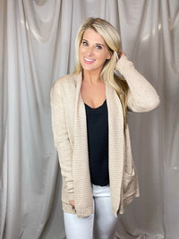 Cardigan features an oatmeal base, heathered detail, open front, long sleeveless light weight material and runs true to size! 