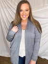 Cardigan features a solid base color, long sleeve, thin material, light weight material, 2 front pockets and runs true to size!- CHARCOAL